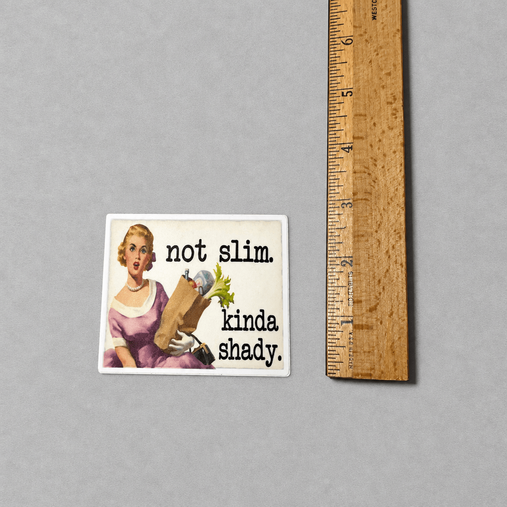 Impish Greetings Not Slim Kinda Shady retro housewife vinyl sticker with matte finish next to a wooden ruler