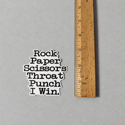 Impish Greetings vinyl sticker with black text reading Rock Paper Scissors Throat Punch I Win on a white background.