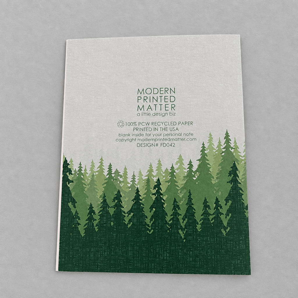 Impish Greetings Sasquatch Legend Dad card back view featuring a green forest illustration on recycled paper