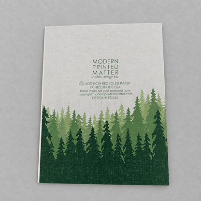 Impish Greetings Sasquatch Legend Dad card back view featuring a green forest illustration on recycled paper