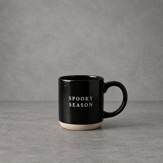 Impish Greetings black stoneware coffee mug with Spooky Season text in white, featuring a natural base.
