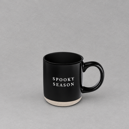 Impish Greetings black stoneware coffee mug with Spooky Season text and a natural speckled base