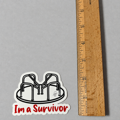 Impish Greetings I’m a Survivor vinyl sticker featuring a black and white playground merry-go-round next to a ruler.