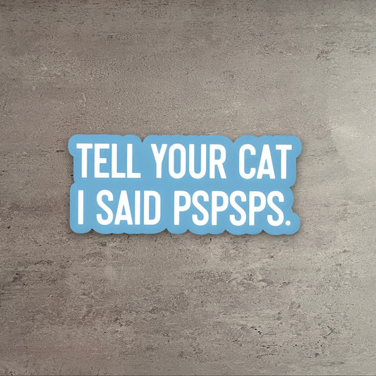 Impish Greetings Tell Your Cat I Said Pspsps vinyl sticker with white text on a light blue background.