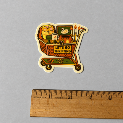 Impish Greetings Let's Go Thrifting sticker featuring a vintage shopping cart filled with thrifted treasures