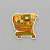 Impish Greetings Let's Go Thrifting sticker featuring a vintage shopping cart filled with retro treasures and decor.