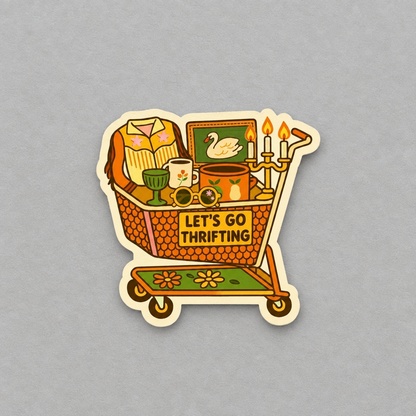 Impish Greetings Let's Go Thrifting sticker featuring a vintage shopping cart filled with retro treasures and decor.