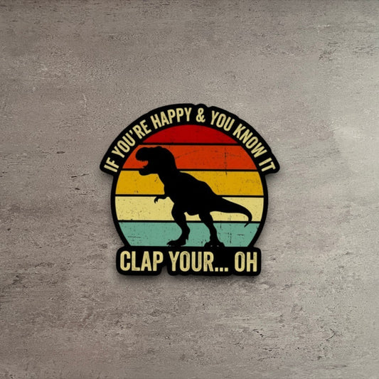 Impish Greetings vinyl sticker featuring a T-Rex silhouette against a retro sunset with funny text on wood background
