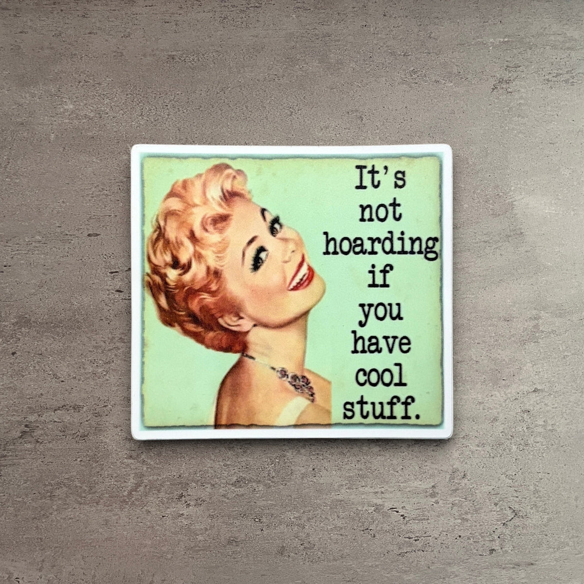 Impish Greetings vinyl sticker featuring a vintage-style woman and the text It's Not Hoarding If You Have Cool Stuff.