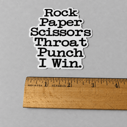 Impish Greetings vinyl sticker with black text reading Rock Paper Scissors Throat Punch I Win on a white background
