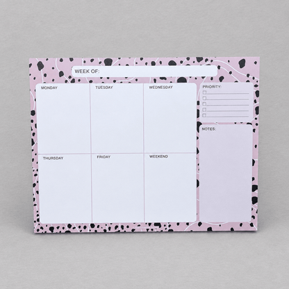 Impish Greetings Week Of Productivity Notepad with pink and black dalmatian print border and daily planning sections.