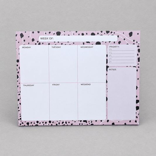 Impish Greetings Week Of Productivity Notepad with pink and black dalmatian print border and daily planning sections.