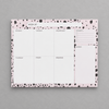 Impish Greetings Week of Productivity notepad with a pink and black dalmatian print border on a grey background.
