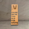 Impish Greetings kraft paper wine gift bag with black text reading Cause We're Too Old For Shots
