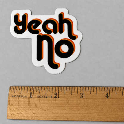 Impish Greetings Yeah No glossy sticker with retro black, orange, and yellow typography on a grey background.