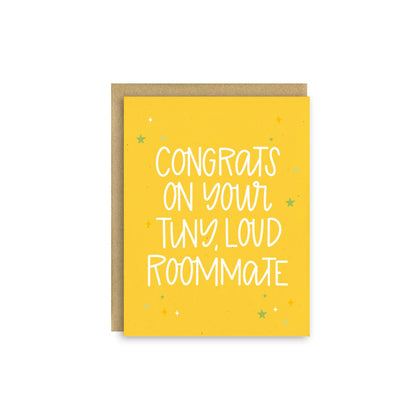 Impish Greetings baby shower card with yellow background and white text reading Congrats on Your Tiny Loud Roommate