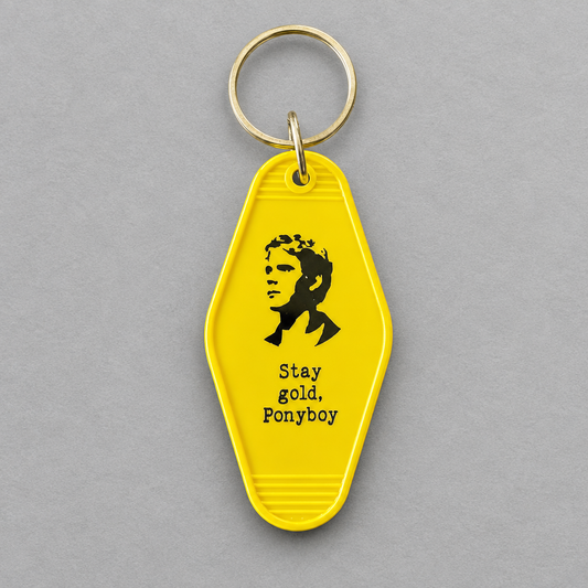 Impish Greetings yellow vintage-style motel key fob featuring a Ponyboy silhouette and Stay gold Ponyboy text.