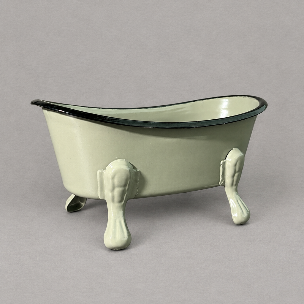 A grey antique clawfoot soap holder with a grey inside against a grey background