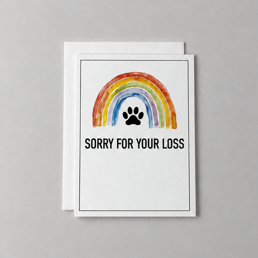 This sorry for your loss condolence card has a watercolor rainbow and paw print with the words "sorry for your loss". It is against a light grey background