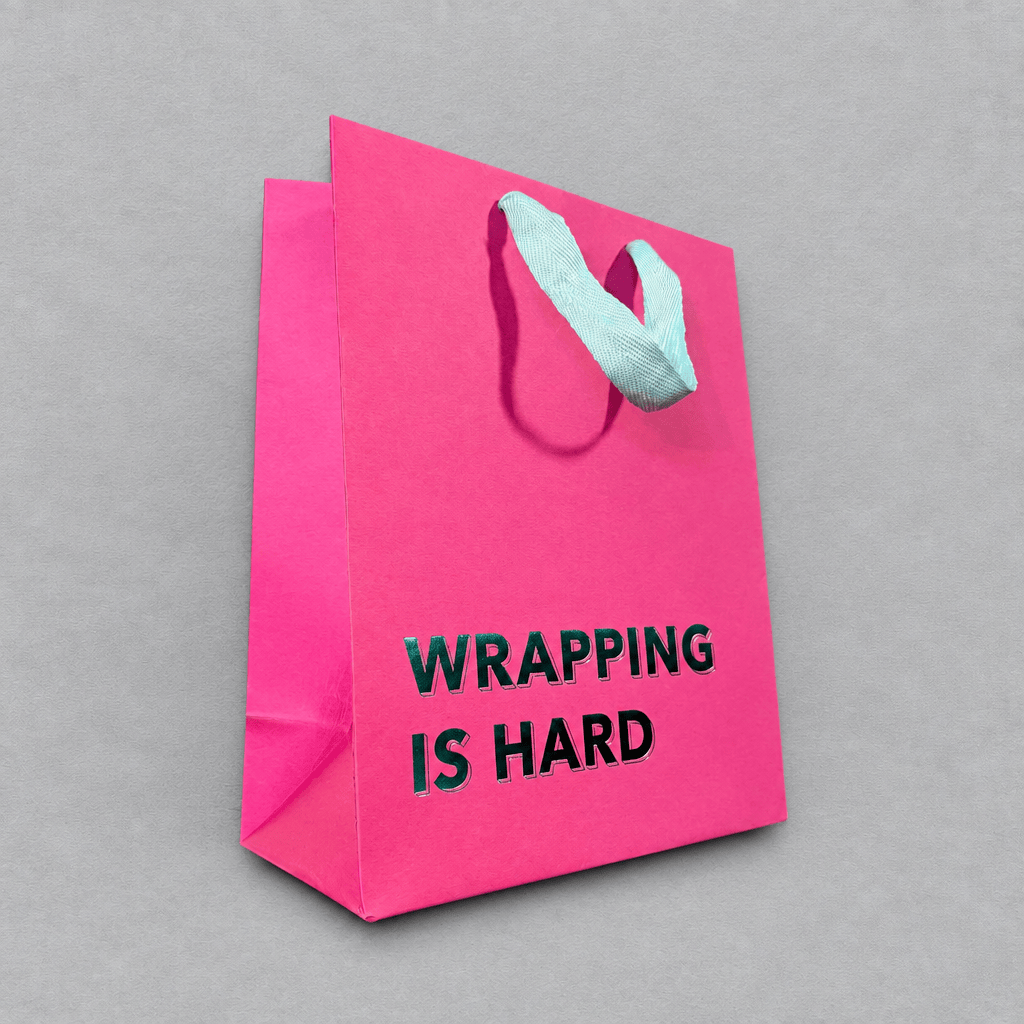 Wrapping is Hard Gift Bag Magenta photo 2 on the lighter grey backdrop