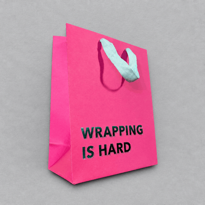 Wrapping is Hard Gift Bag Magenta photo 2 on the lighter grey backdrop