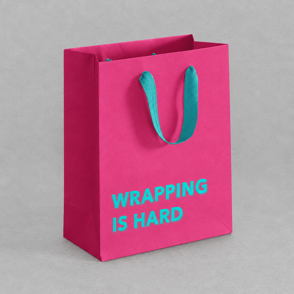 Wrapping is Hard Gift Bag Magenta photo 3 on the lighter grey backdrop